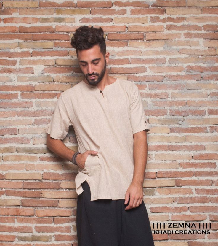 "Zemna Tribal Shirt for Man made from hand-spoon and hand-woven Indian cotton \"Khadi\" , has a pocket on the right side and a coconut button at the neck. Colors: *Natural, non bleached - Available in S (2) and M (2), L (2) and XL (one piece) sizes. *White - Available in S (2 pieces) and M (1 pieces), XL (1 piece) Khadi is made without any synthetic fibers, so its environment friendly and doesn't cause skin allergies, healthy for both body and spirit! In India, Khadi is not just a cloth, it is a Traditional Cotton T-shirt For Summer, Traditional Short Sleeve Summer Kurta, Casual Cotton Kurta With Short Sleeves, Casual Linen Kurta For Summer, Traditional Cotton Kurta With Short Sleeves, Traditional Short Sleeve Cotton Kurta, Traditional Short Sleeve Shirt With Relaxed Fit, Traditional Relaxed Fit Short Sleeve Shirt, Traditional Short Sleeve Summer Shirt