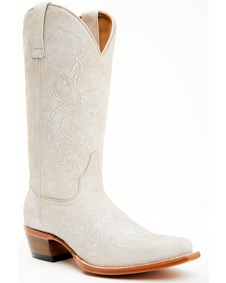 a pair of white cowboy boots on a white background