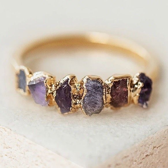 PURPLE OMBRÉ BIRTHSTONE RING! The Crystals: Amethyst, spinel, pink sapphire, and tanzanite Birthstones: February, August, September, and December Good Vibes: Clarity, balance, royalty. #birthstonejewelry #bohostyle #crystaljewelry #gemstonejewelry #Regram via @www.instagram.com/p/B--O_peBs8D/ Gold Amethyst Crystal Ring With Gemstone, Purple Fine Jewelry With Natural Stones, Purple Natural Stones Jewelry, Purple Gemstone Rings For Jewelry Making, Gold Amethyst Jewelry With Accent Stones, Amethyst Multi-stone Healing Jewelry, Purple Amethyst Rings With Gemstone Accents, Purple Amethyst Birthstone Ring With Gemstone Accents, Gold Amethyst Ring For Healing