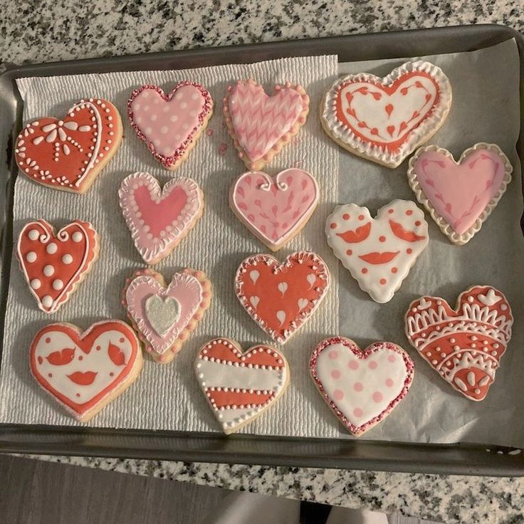 heart shaped cookies are arranged on a piece of paper