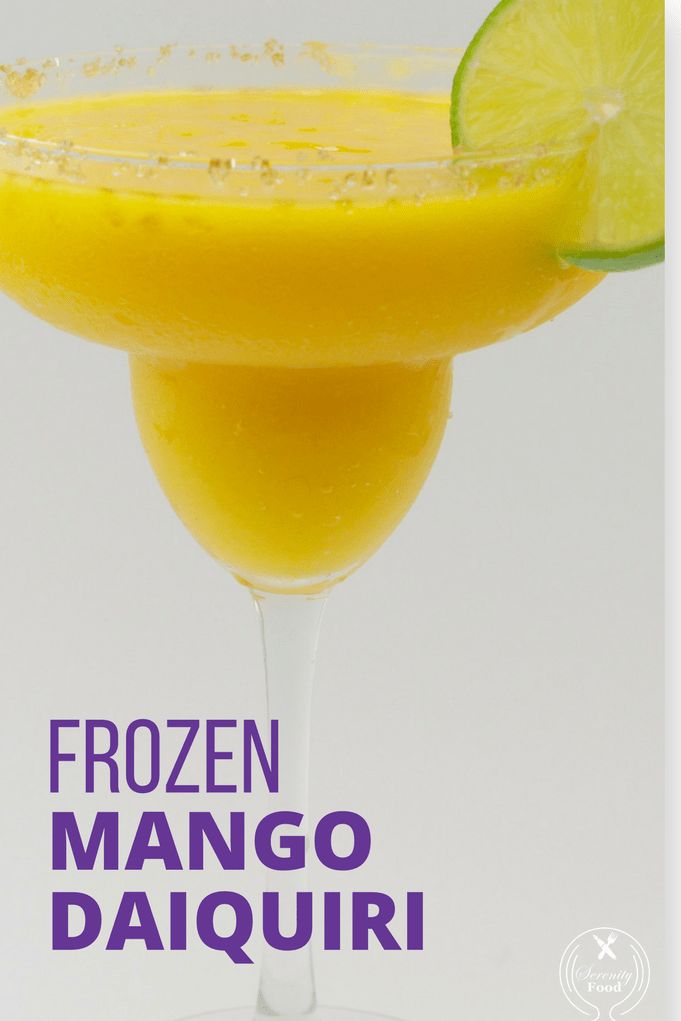 the frozen mango daiqui is garnished with a lime