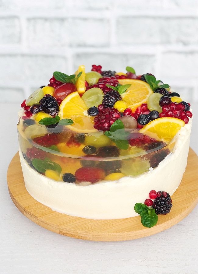 a fruit cake on a wooden platter