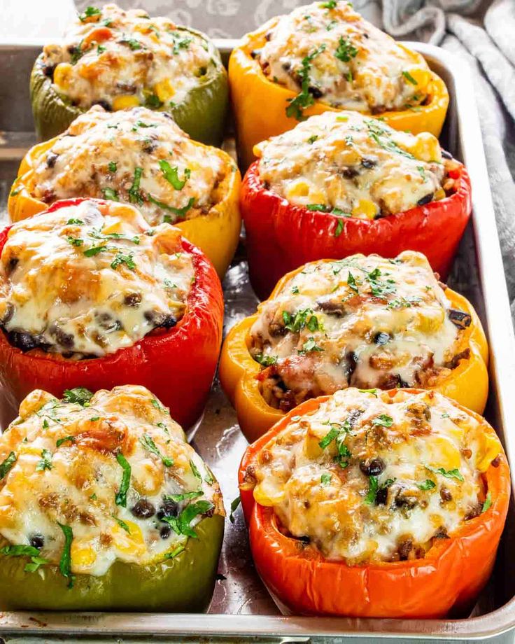 several stuffed peppers in a baking pan with the words southwest style stuffed peppers above them