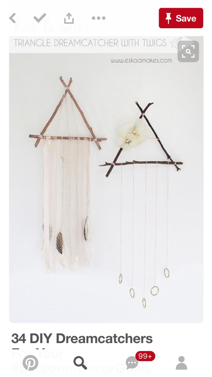 two dream catchers are hanging on the wall next to each other, one is made out of sticks