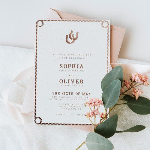 wedding stationery with pink flowers and greenery