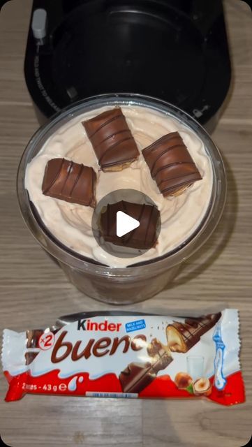 some kind of dessert sitting on top of a table next to a bar of chocolate