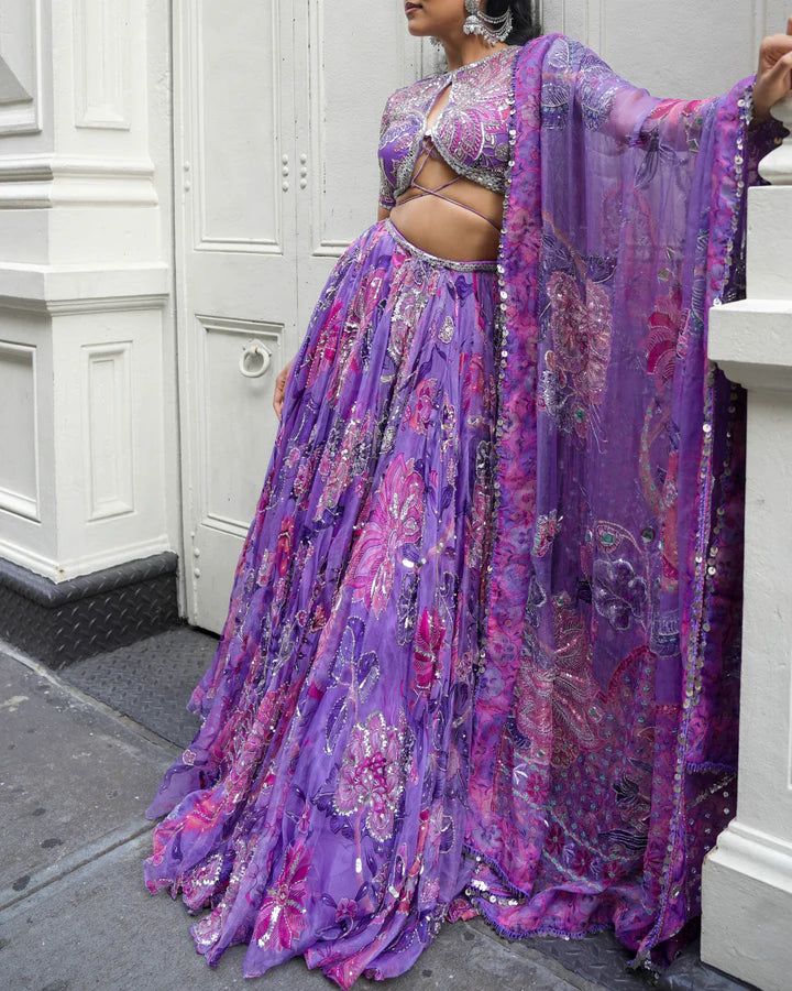 Embroidered Lehenga With Embroidered Blouse Featuring Our Signature Tie-up Detail Paired With A Dupatta.From Mahima Mahajan's Ishq collection. DELIVERY TIMEPlease allow 6-8 weeks for your outfit to arrive. FABRIC DETAILSOrganza Professional cleaning only. Purple Wedding Palazzo Set With Pallu, Purple Palazzo Set With Pallu For Wedding, Embroidered Purple Palazzo Set For Festivals, Wedding Navratri Purple Palazzo Set, Purple Embroidered Palazzo Set For Festive Occasions, Purple Bollywood Palazzo Set With Pallu, Embroidered Purple Palazzo Set For Festive Occasions, Bollywood Style Purple Palazzo Set With Intricate Embroidery, Bollywood Style Purple Palazzo Set With Pallu