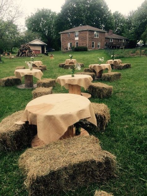 several hay bales are covered with a table cloth