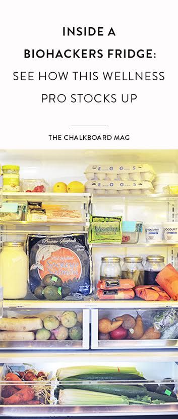 an open refrigerator filled with lots of different types of vegetables and fruit in front of the door