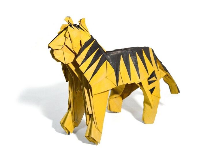 an origami horse that is yellow and black