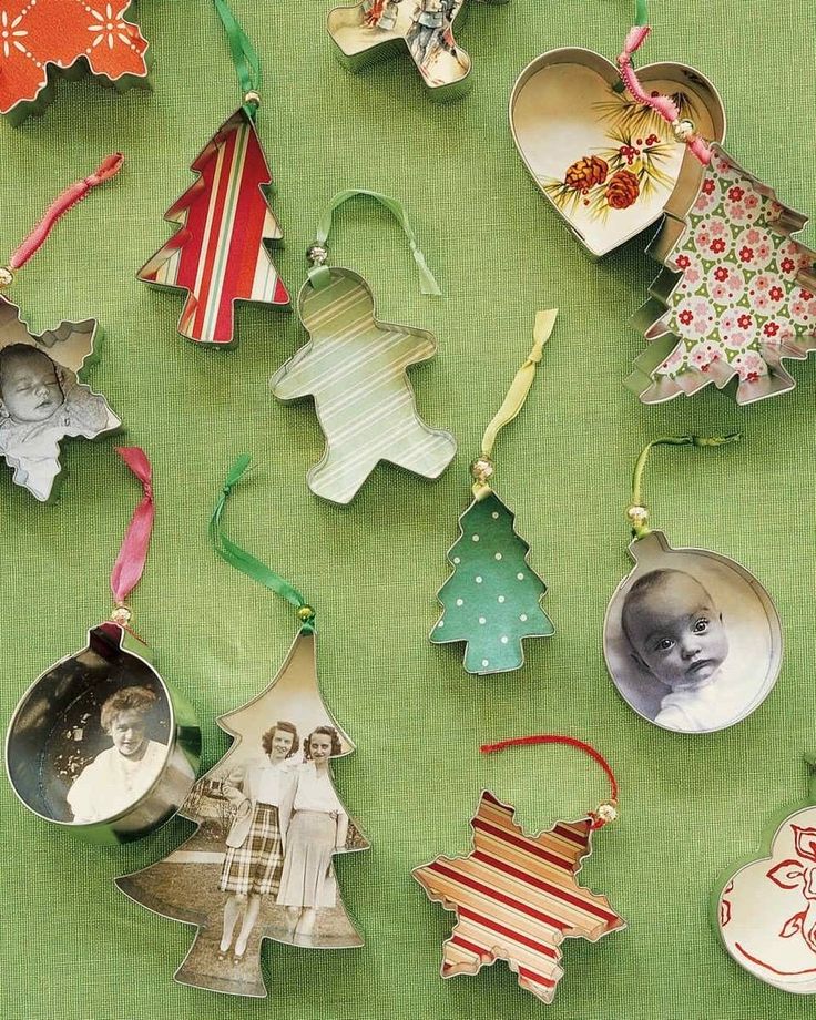 an assortment of christmas ornaments hanging on a green background