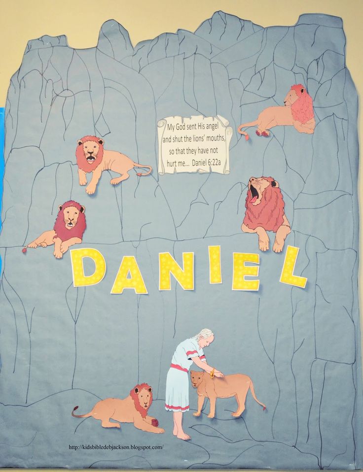 a child's artwork depicting lions on a rock wall with the word daniel written in large letters