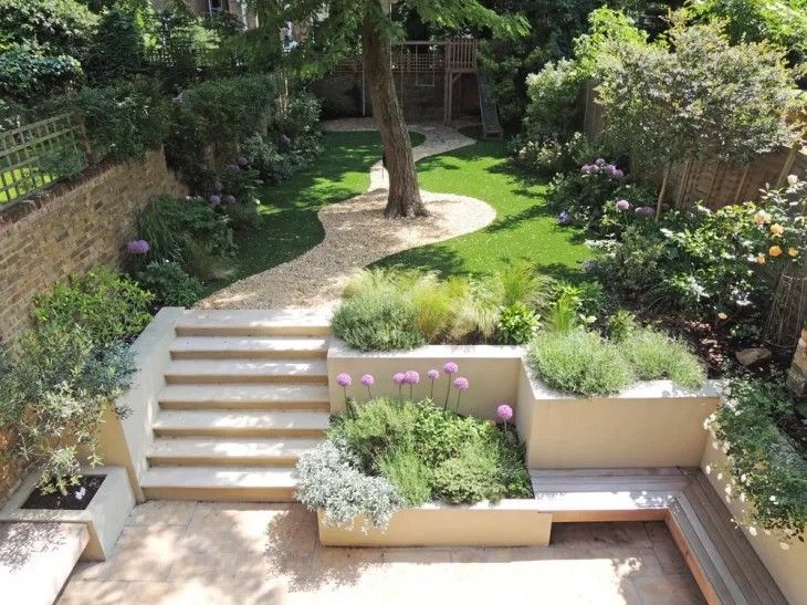 an outdoor garden with steps leading up to it