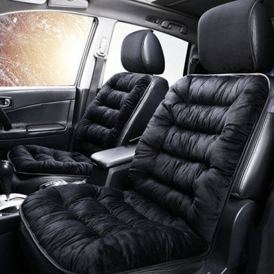 the interior of a car with black leather seats and an air conditioner in it