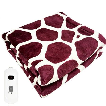 a blanket with a remote control next to it on a white background and an image of a giraffe print