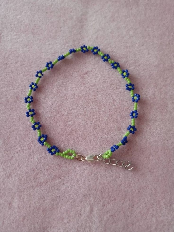 Green ANKLET with cute blue daisies.  Perfect for your summer days.  Anklet is 9 inches long and adjustable. Daisy Anklet, Blue Daisies, Blue Opal Earrings, Green Daisy, Peruvian Blue Opal, Black Onyx Earrings, Blue Daisy, Onyx Earrings, Tucson Az