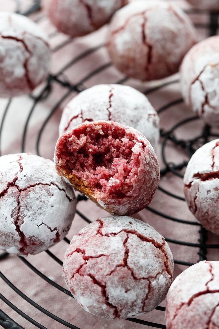 powdered sugar covered pastries are on a wire rack and ready to be eaten