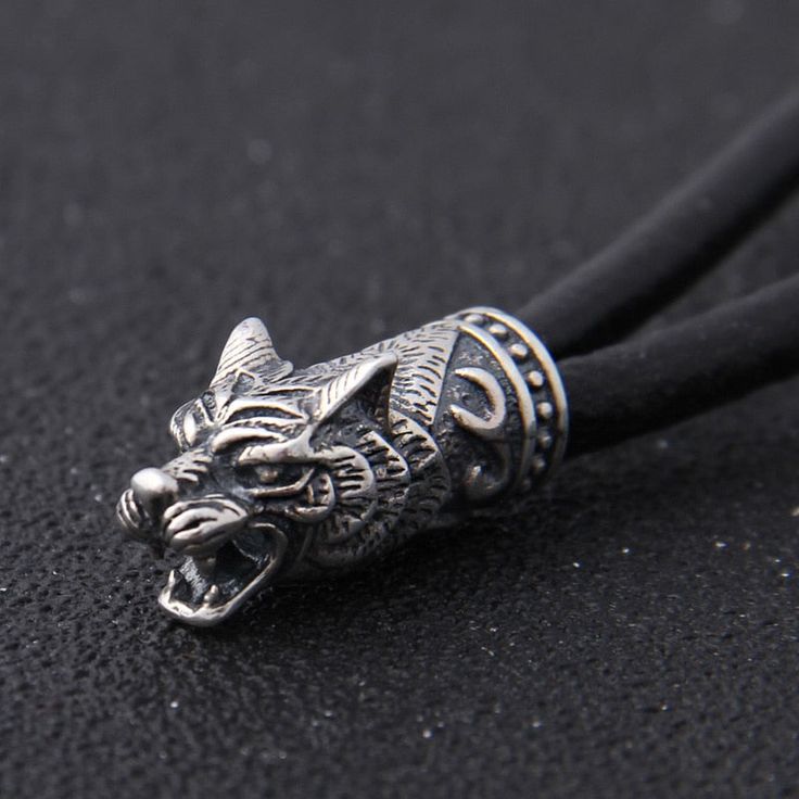 Fenrir has become an enduring symbol of power and strength in Viking culture. As the son of Loki, he embodied the unpredictable and untamed forces of nature that could never truly be controlled. But despite his fearsome reputation, Fenrir is also revered for his courage and tenacity in the face of adversity. In Norse mythology, he was prophesized to play a significant role in the end of the world, known as Ragnarok. Product details: Material: 925 Sterling Silver Material of chain: Cow Leather Si Sterling Silver Wolf Design Jewelry, Adjustable Viking Style Sterling Silver Jewelry, Viking Style Silver Jewelry With Wolf Design, Viking Style Silver Wolf Design Jewelry, Silver Stainless Steel Wolf Jewelry, Silver Wolf Design Stainless Steel Jewelry, Silver Stainless Steel Wolf Design Jewelry, Son Of Loki, Thor's Hammer Mjolnir