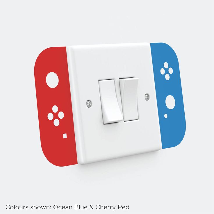 two red and blue buttons on a white light switch cover with the words colours shown ocean blue & cherry red