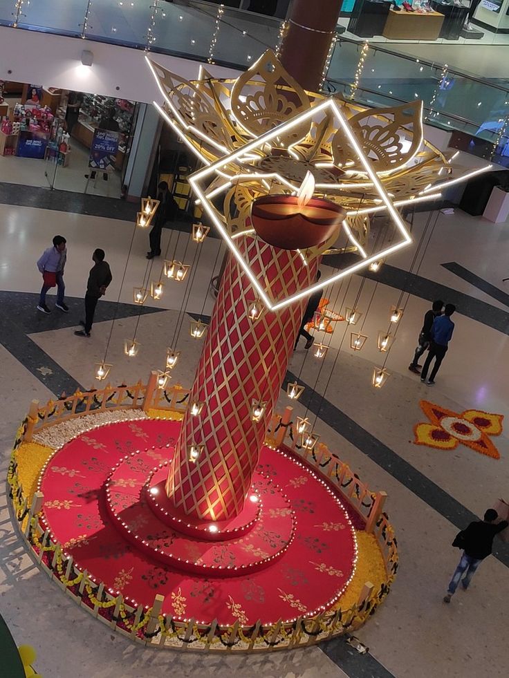 an elaborately decorated lamp in the middle of a mall