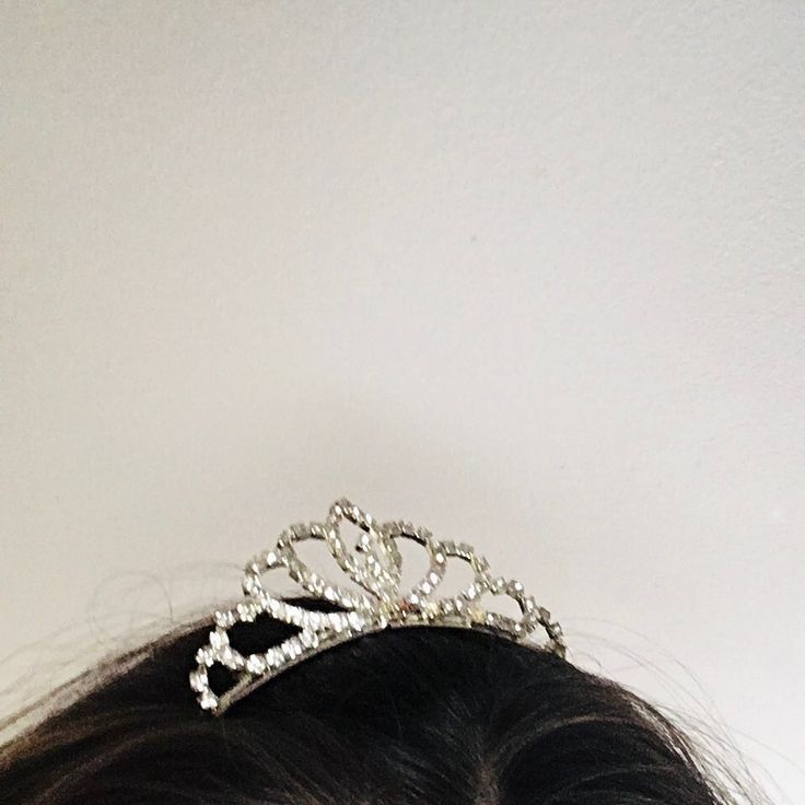 a woman wearing a tiara on her head