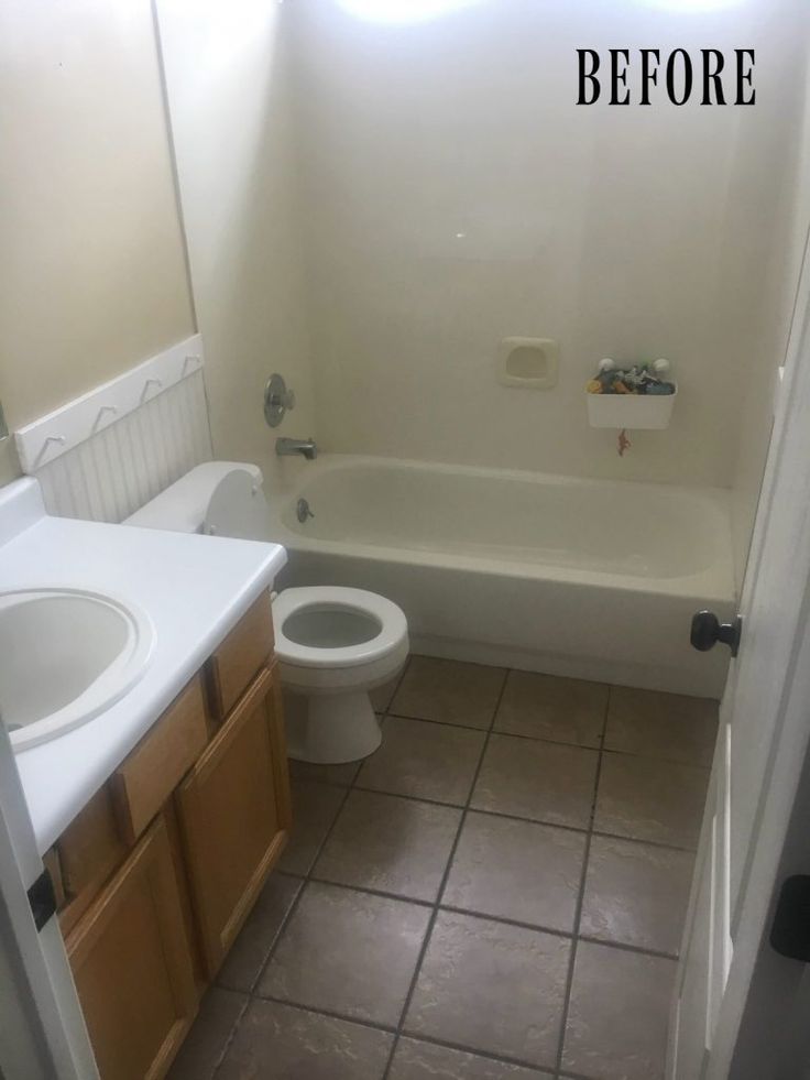 the bathroom is clean and ready to be used as a bathtub, sink, and toilet