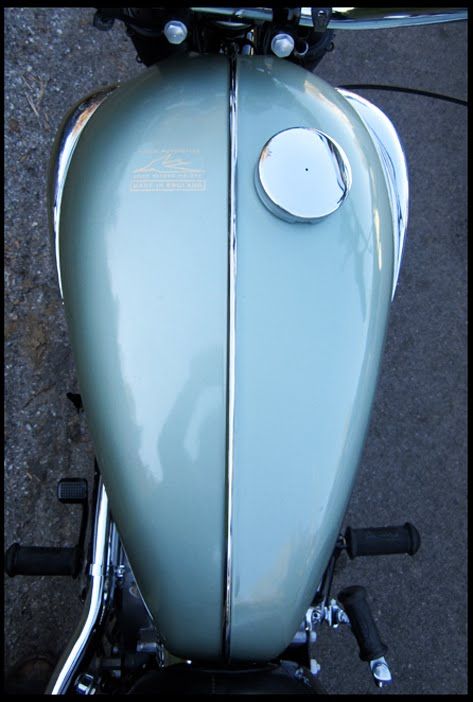 the front end of a light blue motorcycle