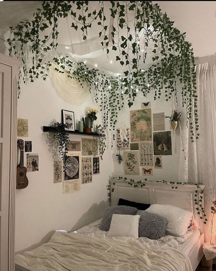 the bedroom is decorated in white and has plants growing on the wall above the bed