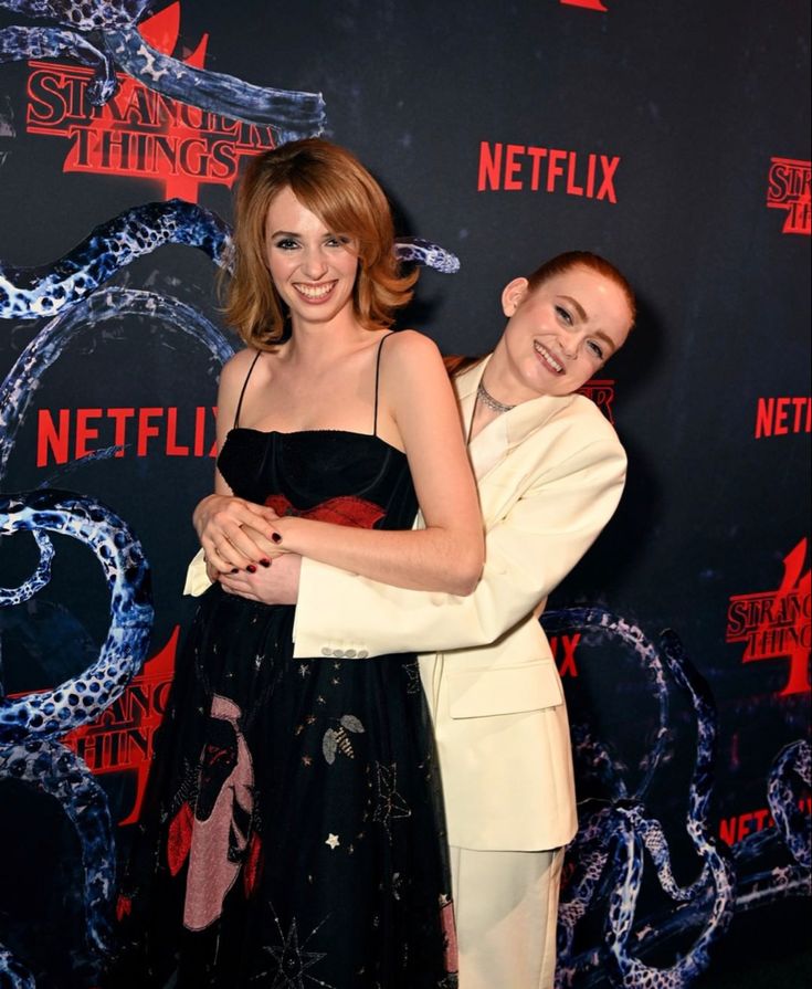 two women hugging each other on the red carpet at netflix's new york premiere