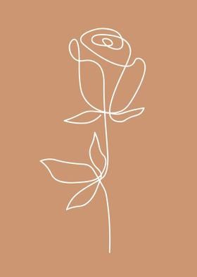 a white rose on a brown background with the word love written in it's center