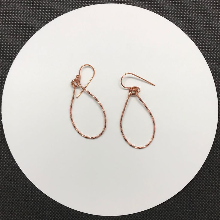 Shiny, lightweight twisted copper teardrop earrings.Approximately 1 1/2" long and 7/8" wideThese earrings have been polished and sealed. Sealed with Protectaclear ProtectaClear is a clear, protective coating that is tough enough to protect jewelry and is safe for wear against skin. ProtectaClear is practically invisible once applied and will seal and protect jewelry from tarnish, oxidation, and corrosion Wire Wrapped Copper Teardrop Earrings, Silver Teardrop Jewelry With Copper Wire, Silver Teardrop Jewelry In Copper Wire, Copper Wire Teardrop Earrings, Elegant Teardrop Copper Wire Earrings, Teardrop Wrap Earrings As Gift, Teardrop Wrap Earrings For Gift, Rose Gold Teardrop Earrings Gift, Rose Gold Hammered Teardrop Jewelry