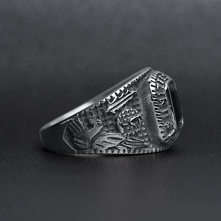 The United States Military Black Stone Women's Army Ring from our Military Collection is custom molded and cast with a premium blend of surgical stainless steel that offers enhanced durability, even after exhaustive wear. The woman's style of the United States Military Black Stone Army Ring is smaller than the men's version but also features a dark black stone centerpiece with detailed sides and "United States Army". This ring is a bulkier-styled ring that is great for women and men who want a c Adjustable Silver Titanium Rings, Tarnish Resistant Silver Stainless Steel Rings, Classic Silver Titanium Rings, Black Stainless Steel Engraved Ring, Silver Titanium Rings With Polished Finish, Durable Silver Promise Ring, Classic Durable Silver Jewelry, Black Titanium Jewelry With Polished Finish, Durable Silver Metal Ring