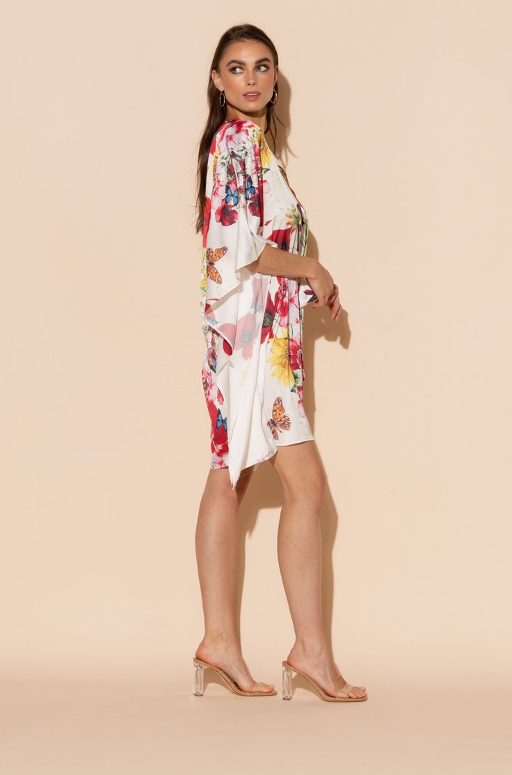 This is one Bouquet you won't want to throw away! Vibrant blooms of flora and fauna adorn this short caftan with tie waist in our signature Polysilk fabric. Dance the night away or lounge in luxe - the occasions are endless with this beautiful, blossoming statement piece. Printed short caftan Can be worn loose or cinched at the waist Comes with a matching belt as an option for styling Lusciously soft poly-silk blend for ease of care Machine wash cool Tumble-dry low Multicolor Floral Print Sleepwear For Spring, Spring Floral Print Multicolor Sleepwear, Spring Multicolor Floral Print Sleepwear, Spring Vacation Sleepwear With Kimono Sleeves, Spring Beach Cover-up Kaftan With Tie Waist, Spring Vacation Kaftan With Tie Waist, Spring Beachwear Kaftan With Tie Waist, Chic Short Sleeve Spring Kaftan, Spring Tunic Kimono For Loungewear