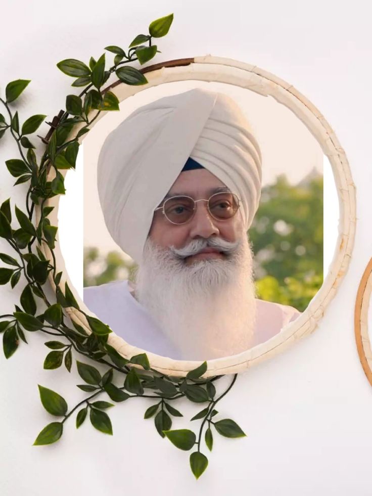 a man with a white turban and glasses in front of a mirror