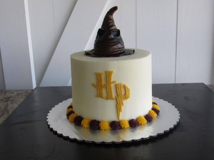 a birthday cake with a hat on top