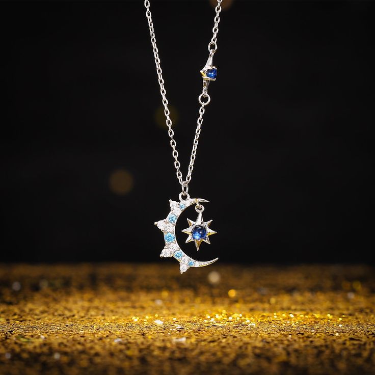 Illuminate your style with our Moon & Eight-pointed Star Necklace featuring a captivating blue diamond. This celestial-inspired piece captures the magic of the night sky, with the moon and star symbolizing dreams and guidance. The addition of the radiant blue diamond infuses a sense of allure, making it a distinct and captivating accessory. Embrace the celestial magic with the Moon & Eight-pointed Star Necklace - a luminous reflection of the cosmos. DETAILS Materials:   925 Sterling Silver, Spin Silver Moon-shaped Magical Necklace, Magical Moon-shaped Sterling Silver Necklace, Magical Moon Shaped Sterling Silver Necklace, Celestial Star Jewelry For Jewelry Making, Magical Silver Moon Jewelry, Magical Silver Jewelry With Sun And Moon Design, Magical Silver Moon Phase Jewelry, Elegant Star-shaped Sun And Moon Necklace, Magical Moon Phase Jewelry