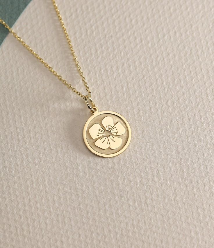 14K Real Solid Gold cherry blossom necklace ● Material of pendant: Solid Gold 14k ( REAL GOLD ) ● Metal Stamp: 14L ( REAL GOLD ) ● The pendant is available in 6 sizes: - 14,0 mm / 0,55 inches ( Diameter ) In the photos - 15,3 mm / 0.60 inches ( Diameter ) - 16,5 mm / 0,65 inches ( Diameter ) - 19,1 mm / 0,75 inches ( Diameter ) - 21 mm / 0,82 inches ( Diameter ) - 23 mm / 0.90 inches ( Diameter ) ( In the photos the size is 14mm / 0.55 inches Diameter ) ( Jump Ring inner diameter: 4 mm ) ● Mater 14k Gold Birth Flower Pendant Jewelry, 14k Yellow Gold Necklace With Birth Flower Detail, 14k Yellow Gold Necklace With Birth Flower, 14k Gold Birth Flower Necklace, Yellow Gold 14k Gold Necklace With Birth Flower, Engraved Yellow Gold Flower-shaped Necklace, Yellow Gold Pendant Necklace With Birth Flower, Yellow Gold Birth Flower Pendant Jewelry, Engraved Yellow Gold Flower Necklace