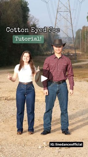 a man and woman standing next to each other on a dirt road with power lines in the background