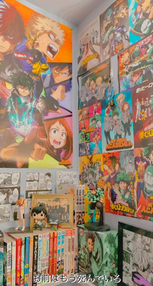 an assortment of anime posters are on the wall above a bookshelf full of comics