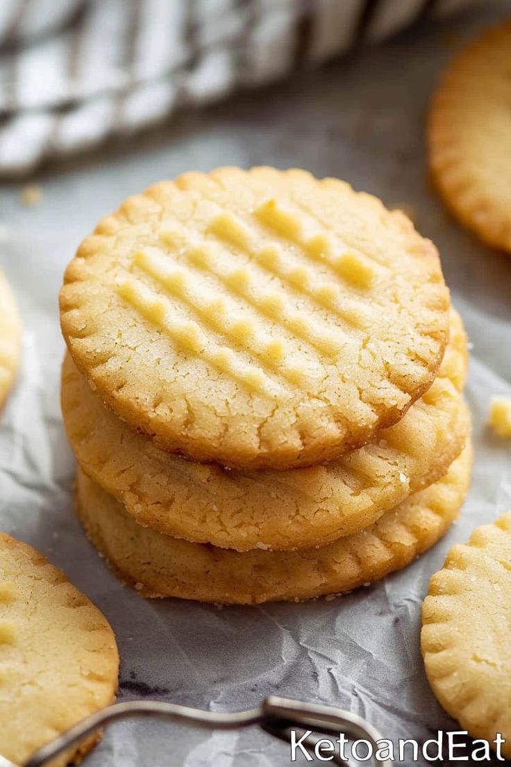 some cookies are stacked on top of each other with a spoon in front of them