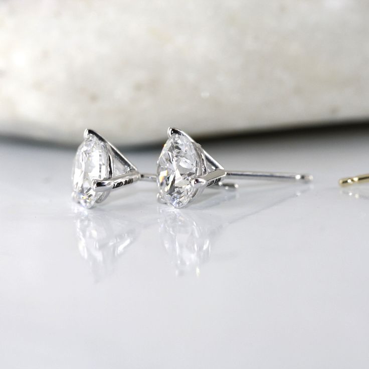 Lab created diamond stud earrings can be a perfect pair of affordable, ethical option. Timeless piece of jewelry that adds elegance and sparkle to any outfit. Make your everyday earrings by choosing Lab Grown Diamonds.Lab Grown Diamond are created in a laboratory in NYC using advanced technological processes. The result is a diamond that is identical to natural diamonds. Lab-created diamonds are available in a wide variety of styles, cuts, and settings, just like mined diamond. EAR-2.00cttw-3P-1 Diamond Stud Earring, Half Eternity Wedding Band, Diamond Stud Earrings, Diamond Stud, Everyday Earrings, 2 Carat, Lab Created Diamonds, Stud Earring, Diamond Earrings Studs