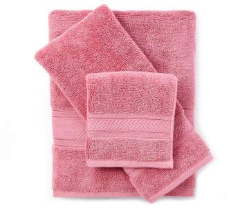 three pink towels stacked on top of each other in front of a white background,