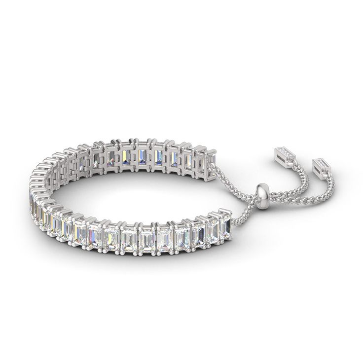 Illuminate her wrist with the lavish look of this gleaming sterling silver adjustable tennis bracelet. A row of emerald stones radiate optimal shimmer. Uniquely designed, each shimmering stone is set to appear extra large and more brilliant, creating twice the sparkle. Held together with a bolo clasp, this bracelet is a chic mix of glamour and elegance.Width: 5.6 mmHeight: 7.4 mmThickness: 4.1 mmMaterial: 925 SilverStone Type: Jeulia® StonePlating Color: SilverBracelet Size: 250 mm Adjustable Silver Gemstone Tennis Bracelet, Adjustable Tennis Bracelet With Sparkling Stones, Silver Emerald Cut Tennis Bracelet, Dazzling Adjustable White Gold Tennis Bracelet, Adjustable Dazzling White Gold Tennis Bracelet, Emerald Cut Tennis Bracelet As Gift, Elegant Adjustable Baguette Cut Jewelry, Dazzling Adjustable Tennis Bracelet, Luxury Adjustable Gemstone Tennis Bracelet