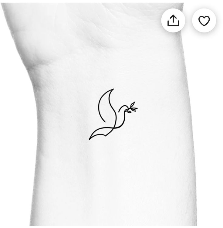 a small bird tattoo on the back of a woman's left arm, with an arrow