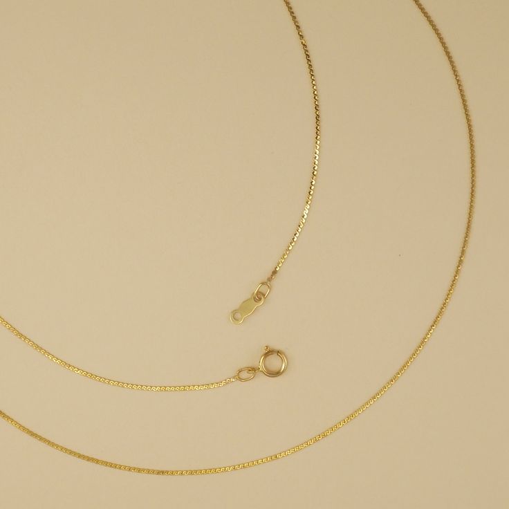 A very fine serpentine chain. This is best when paired with very small charms. Comes in 925 sterling silver or gold filled. Spring ring clasp. 1mm link width. Delicate 14k Gold Curb Chain Jewelry, 14k Gold Dainty Curb Chain Jewelry, Gold Sterling Silver Snake Chain Charm Necklace, Dainty Sterling Silver Jewelry With Curb Chain, Delicate Gold Jewelry With Curb Chain, Gold Sterling Silver Curb Chain Necklace, Dainty Charm Necklaces With Curb Chain For Gifts, Delicate Yellow Gold Snake Chain Necklace, Minimalist Sterling Silver Curb Chain Jewelry