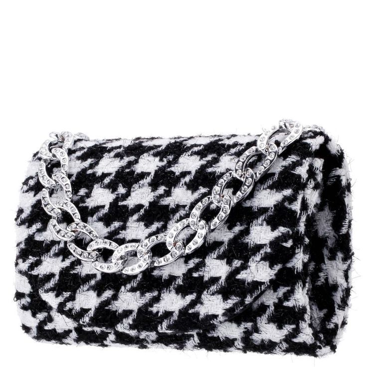 Take this Touch of Nina Dorit clutch out for a night on the town. Take this Touch of Nina Dorit clutch out for a night on the town. 8"H x 5.125"W x 2.375"D Chain-link strap drop length: 44" Removable shoulder strap Closure: magnetic snap Interior: 1 slip pocketCONSTRUCTION & CARE Body: faux fur Lining: synthetic fabric Blot clean with damp cloth Imported Size: One Size. Color: Oxford. Gender: female. Age Group: adult. Luxury Handbags 2022, Luxury Handbags Louis Vuitton, Louis Vuitton 2023, Handbags 2022, Luxury Bags Collection, Black And White Tweed, White Tweed, Luxury Designer Handbags, White Houndstooth