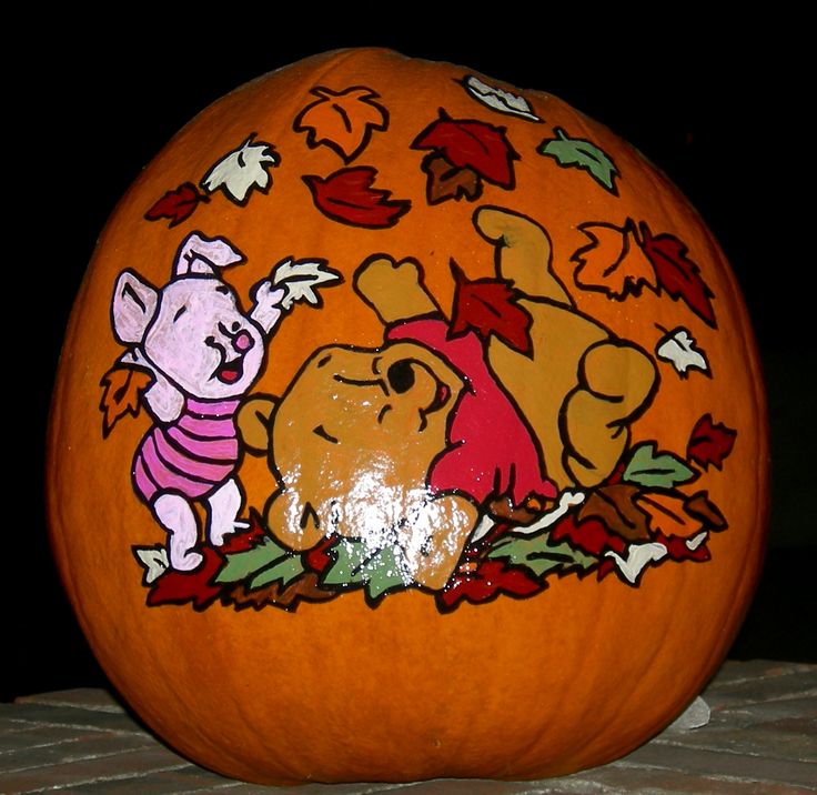 a carved pumpkin with winnie the pooh on it