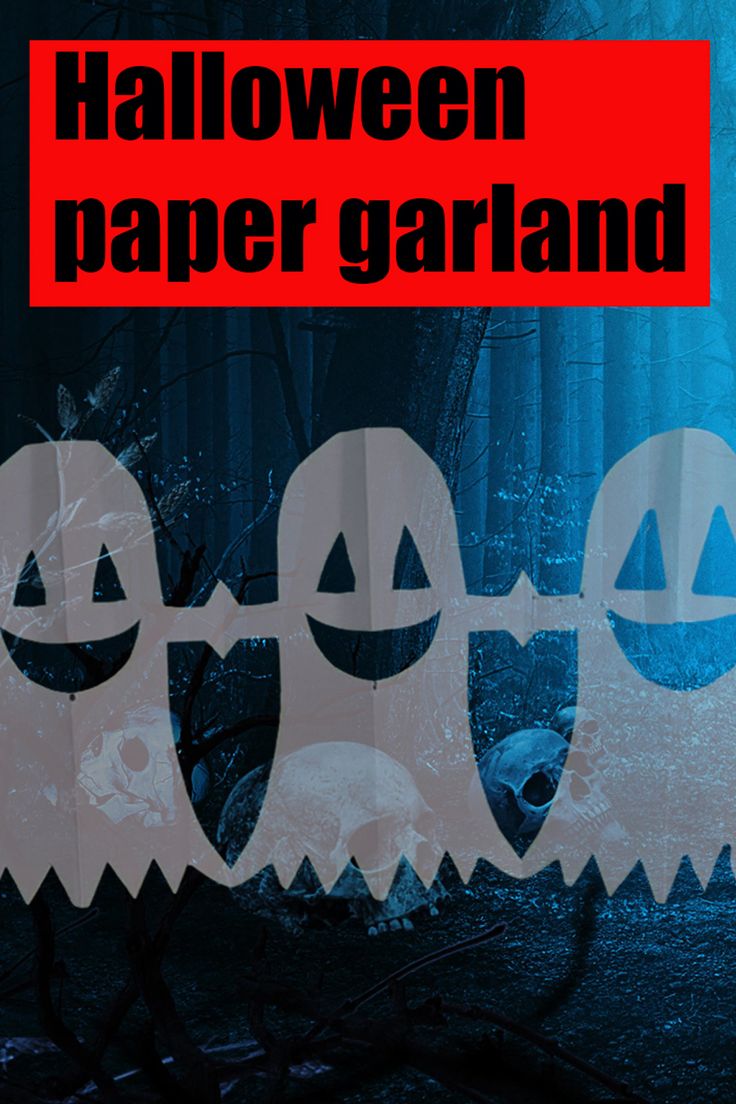 halloween paper garlands with ghost faces and bats on them in front of a forest