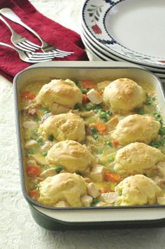 a casserole dish filled with chicken and dumplings