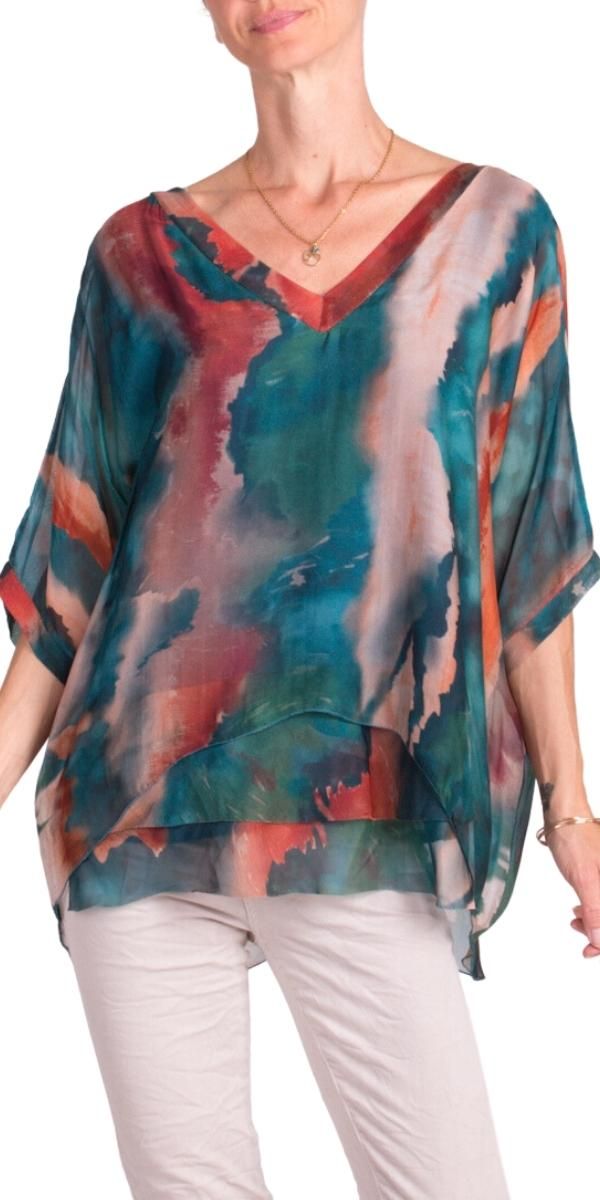 Ink Watercolor Design on 100% Silk Blouse with Frayed Raw Edge Hemline. Soft, Stretchy Viscose Layer Underneath. 100% Silk Exterior | 95% Viscose | 5% Elastic Interior Made in Italy Fits Sizes XS- XL Model 5'7 Multicolor V-neck Rayon Blouse, Green Silk V-neck Top, Silk V-neck Printed Tops, V-neck Beach Top With Abstract Print, Multicolor Silk Shirt For Spring, Summer Silk V-neck Blouse, Green Viscose Top For Vacation, Green Viscose Tops For Vacation, V-neck Blouse With Abstract Print For Vacation